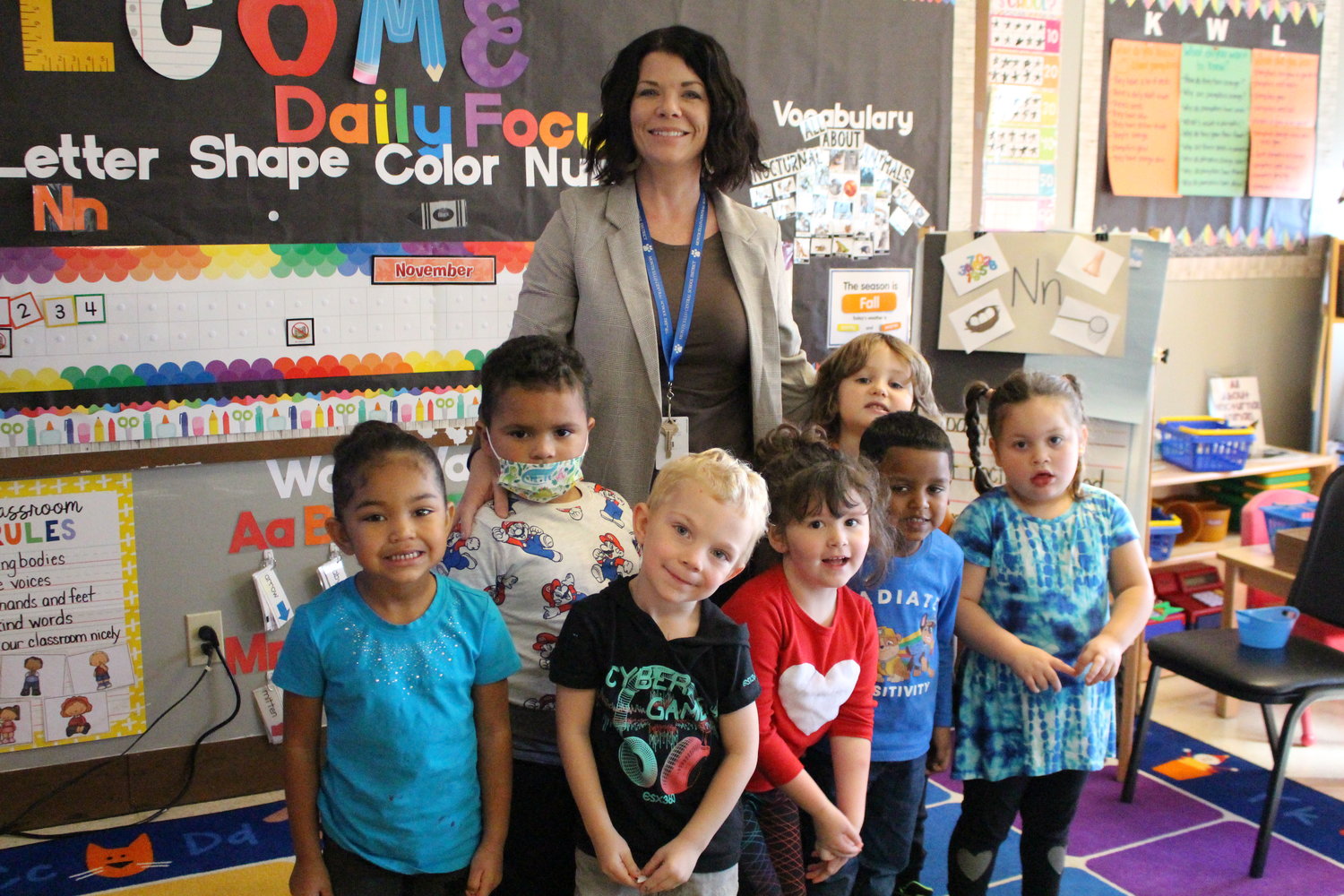 SJSCS principal Jen Gorr poses with preschool students.